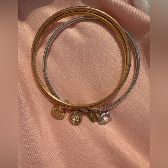 Coach 3 bangle bracelets 2 gold plated and 1 silver All have dangly charms